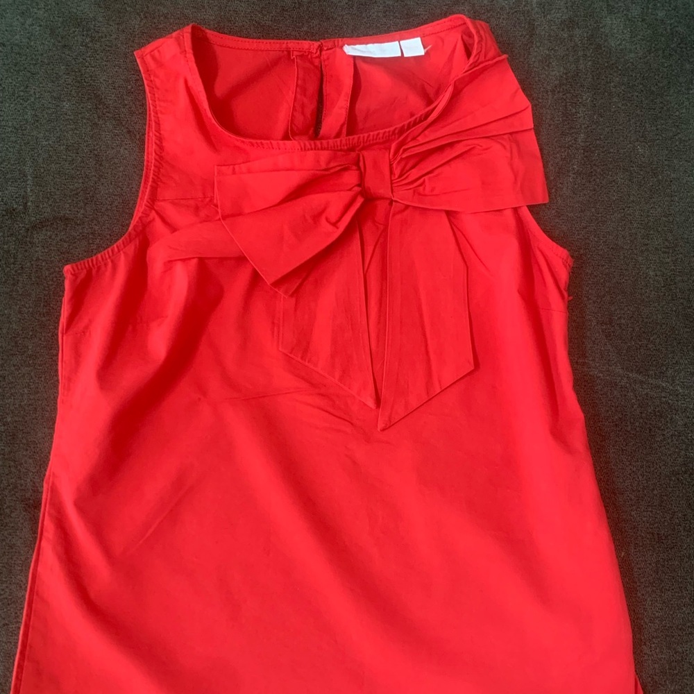Beautiful big red bow top! Zipper on side and small button on back part of neck.
